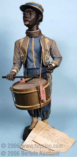 papier-mache figure of a Black Drummer Boy with an intriguing drumstick regulated clockwork